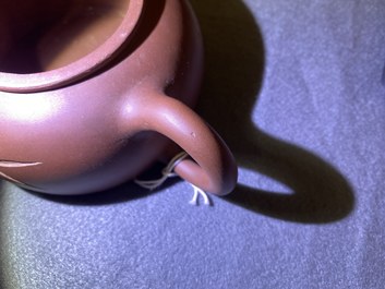 Two Chinese Yixing stoneware teapots and a famille rose 'Shou Lao' group, Kangxi and 20th C.